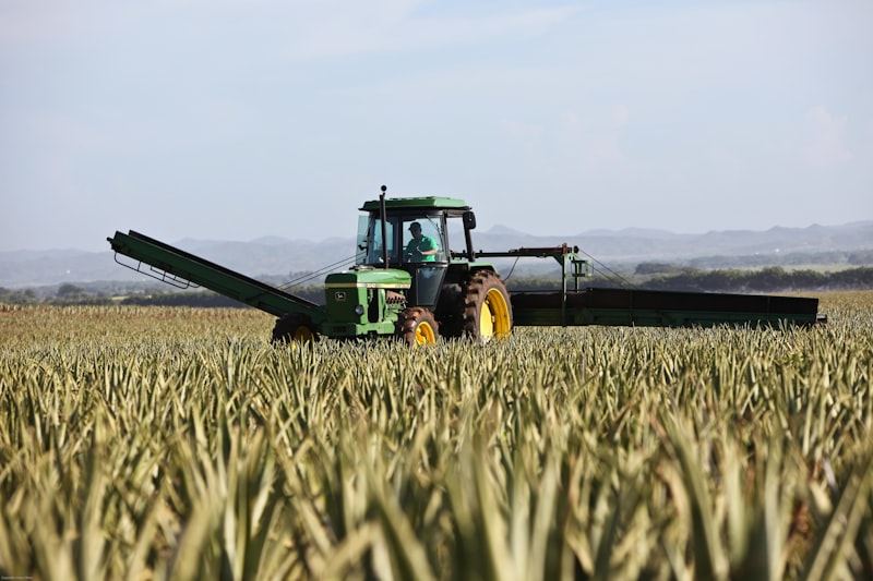 Harvester working across farmland